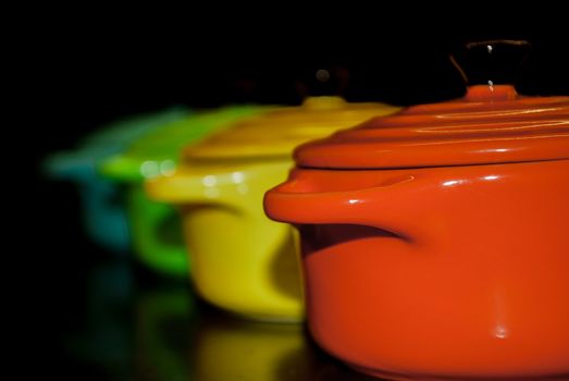 Four colorful and vibrant bowls in a row