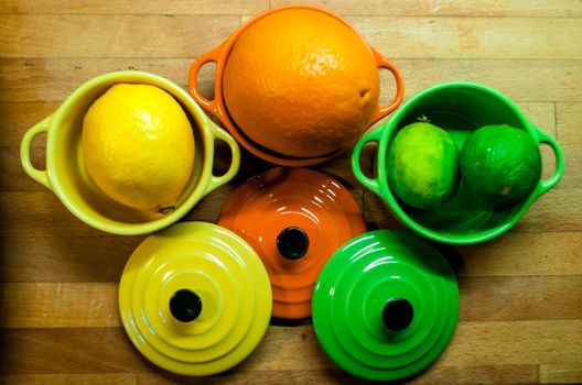 Orange, lemon and lime in bowls