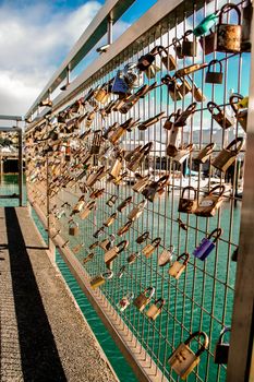 Padlocks loked on fence as symbol of love