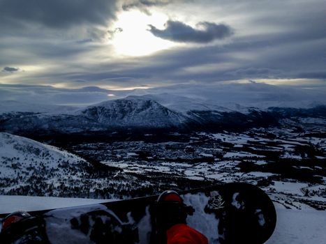 First person look from snowboarder looking out over the landscape