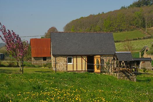 Small stone cottage at peaceful French countryside
