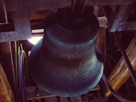 Indoor view of huge metallic bell, inside of church at Netherlnds