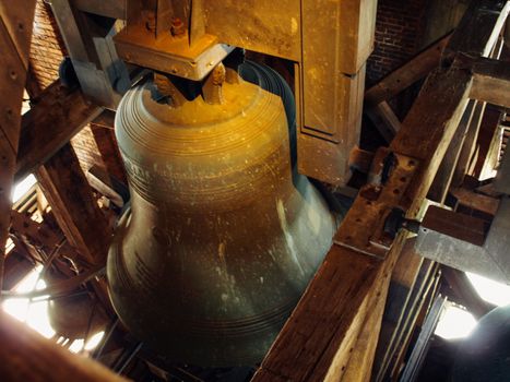 Indoor view of huge metallic bell, inside of church at Netherlnds