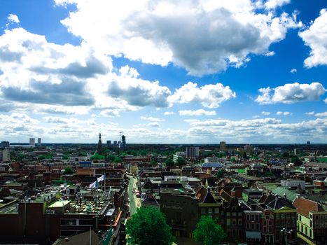 View over historic part of Groningen city under blue sky with clouds, Netherlands