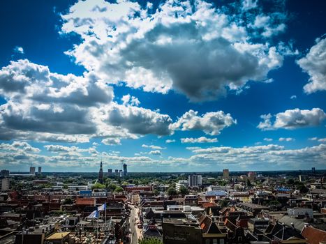 View over historic part of Groningen city under blue sky with clouds, Netherlands