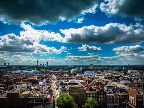 View over historic part of Groningen city under blue sky with clouds, Netherlands