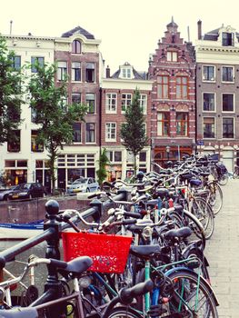 Bikes parked on a bridge in Amsterdam at summer Netherlands