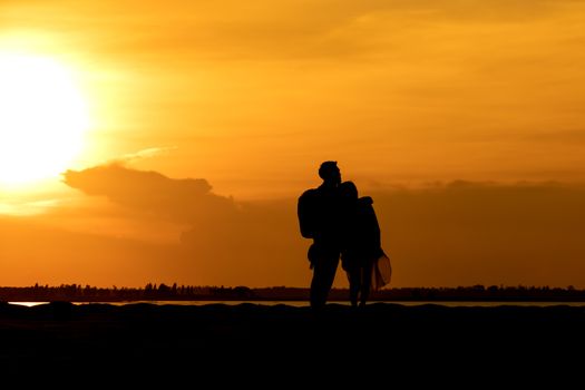 Silhouette traveler couples  on mountain at sunset times