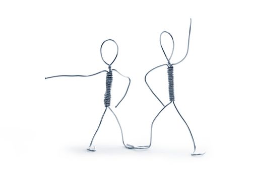 Two men made from aluminum wire discussing on white background