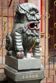 Marble lion at the entrance of a temple, Vietnam