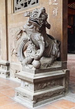 Marble lion at the entrance of a temple, Vietnam