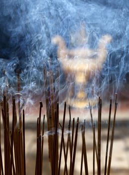 Burning incence sticks in a Buddhist temple