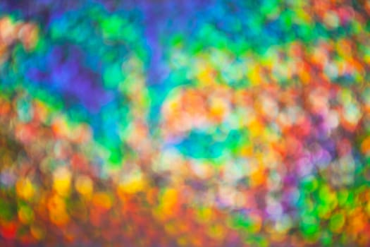 Abstract blurred background with numerous colourful bright festive bokeh. Texture with copy space for text. Celebration, holidays concept. Horizontal and vertical