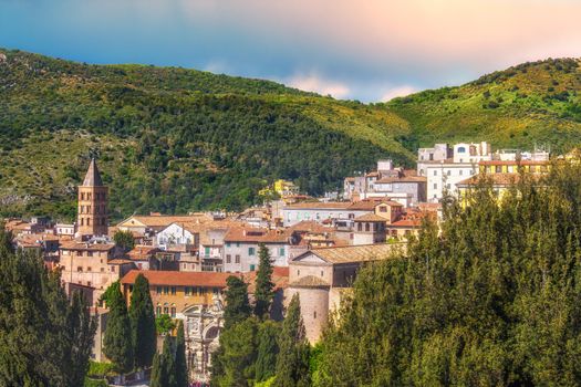 panoramic italian town of Tivoli near Rome in Lazio surrounded by a lush forest .