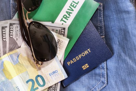 Set of trip stuff on wooden background.Travel set of passport money and tickets for travel on vacation.