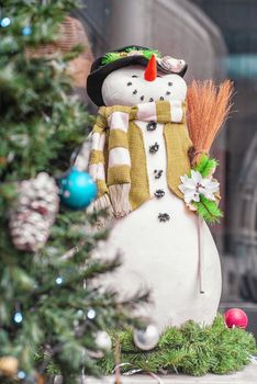 Christmas snowman.Festive snowman with Christmas light background.