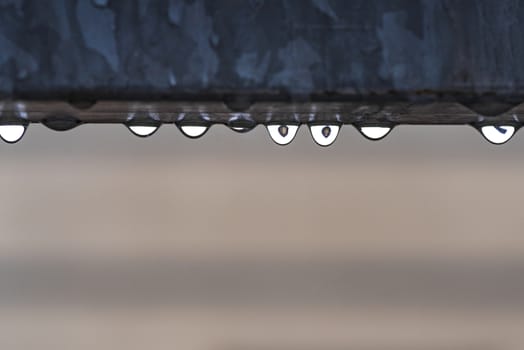 Water drop on light background, top view.Drops on a gray background. Raindrops. Water drop on light background, top view.