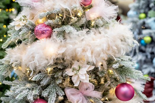 The decor on the Christmas tree on which the New Year's toys are hanging . Xmas concept. soft selective focus