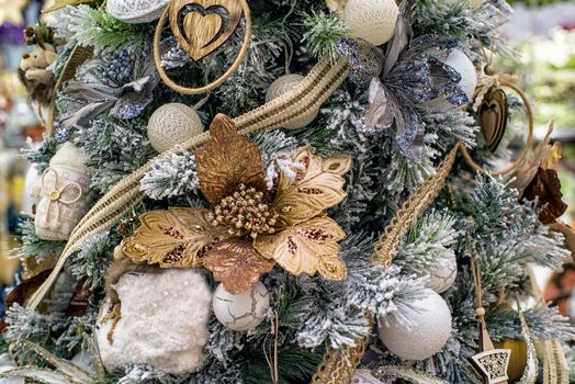 The decor on the Christmas tree on which the New Year's toys are hanging . Xmas concept. soft selective focus