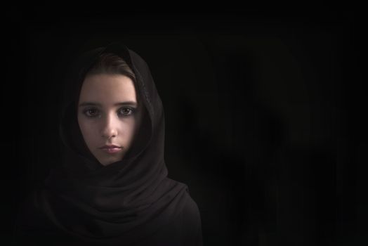 Arab girl close-up. Eyes of the Arab girl.Young arabian woman in hijab. close-up beautiful mysterious eyes eastern woman wearing a hijab