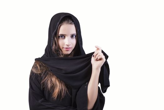 Arab saudi emirates woman face looking at side isolated on a white background. Arab girl closeup on a white background.Muslim.