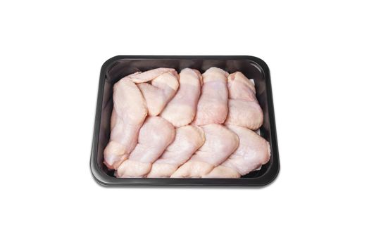 Chicken wings in a plastic container. Photos for designers. Izolyad. Factory packaging.chicken wings in a plastic container. Meat of poultry in tray, isolated on white background. Top view