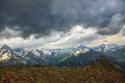 Panorama of mountains scene with dramatic blue sky in national park of Dombay