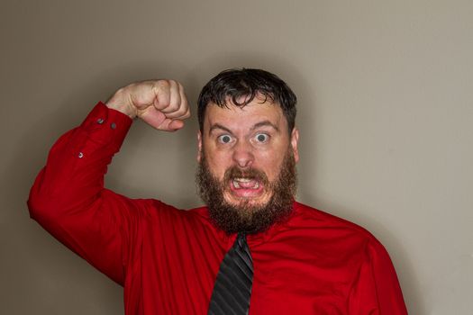 angry coworker raising his fist in anger
