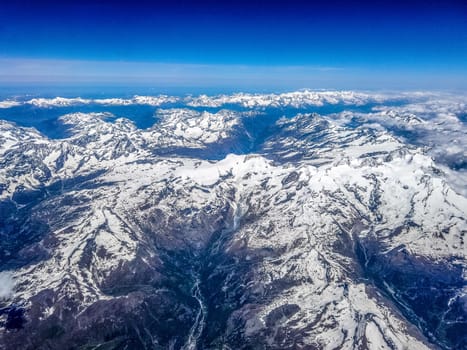 The bird's eye view of Alps snow mountain in Switzerland.