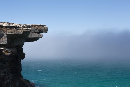 Eagle Rock and a mysterious sea fog hung around all morning and drifting in land and out to sea several times..  Royal National Park, Sydney