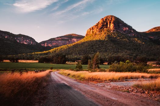 Late afternoon light just before the sun sinks behind the mountain range in the Capertee Valley, regarded as the widest canyon in the world