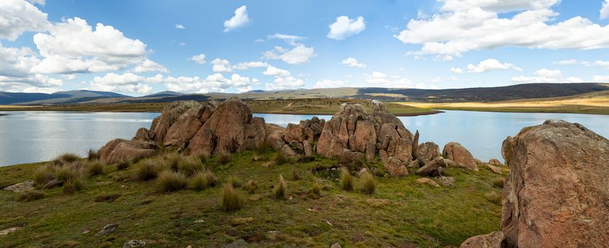 Chilly lakes and snow tundra plains and hills and rocky tors of the Snowy High Plains Kosciuszko National Park panorama of 7 images stitched