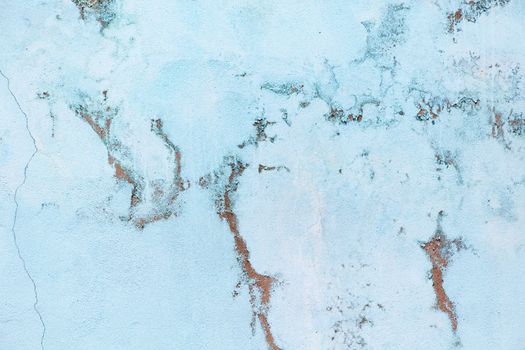 Old pastel blue wall with abrasions. Background with marble effect, copy space, minimal style backdrop.