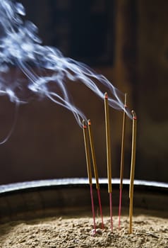 Burning incence sticks in a Buddhist temple