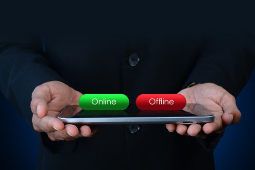 Business man with online and offline button