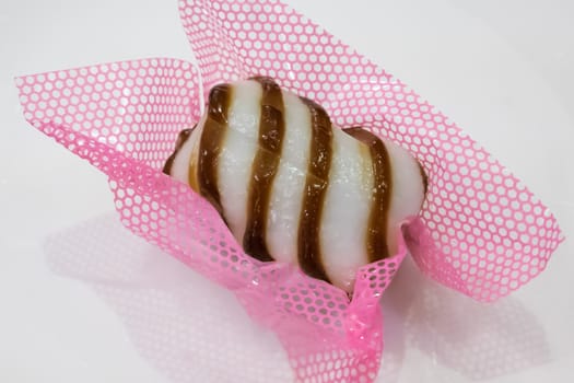 The close up of Taiwanese mochi candy dessert on the white table.