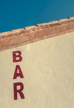 A Rustic Sign For A Bar In The American Southwest With Copy Space