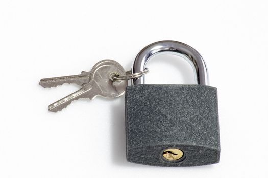 A gray padlock with sandy rough texture with 2 keys attached