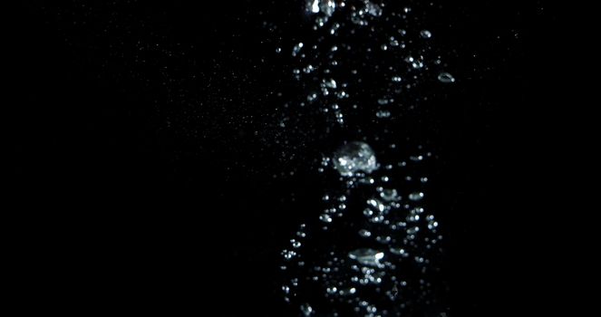 Blurry images of drinking water liquid bubbles or carbonate drink or oil shape or soda splashing and floating drop in black background for represent sparkling refreshment and refreshing