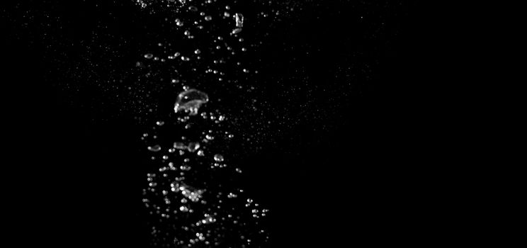 Blurry images of drinking water liquid bubbles or carbonate drink or oil shape or soda splashing and floating drop in black background for represent sparkling refreshment and refreshing