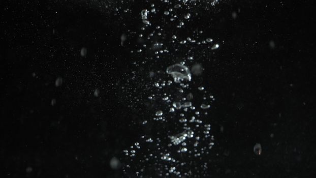 Blurry images of drinking water liquid bubbles or carbonate drink or oil shape or soda splashing and floating drop in black background for represent sparkling refreshment and refreshing