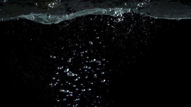 Blurry images of drinking water liquid bubbles or carbonate drink or oil shape or soda splashing and floating drop in black background for represent sparkling refreshment and refreshing