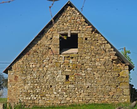 Back view on small old stone farm house