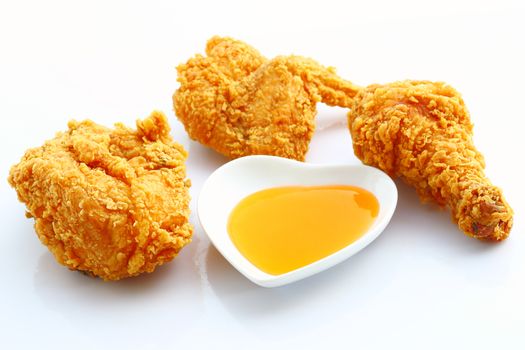 Group of fried chicken with sauce isolated on white background.
