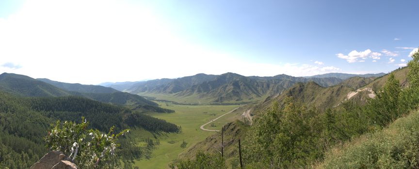 Panoramic picture of the fertile valley and the Chike-Taman pass going through it. Gorny Altai, Siberia, Russia.