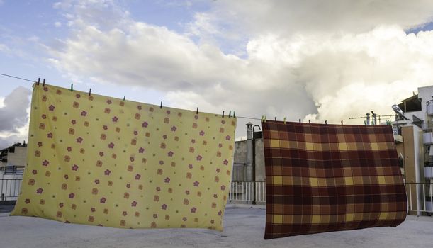 Drying bedclothes on the roof of a dwelling house in Athens, Greece