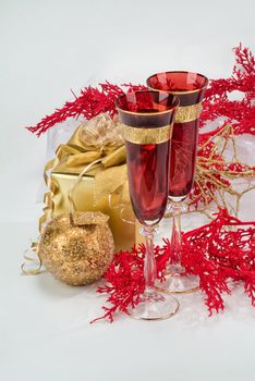 Glasses with wine on a decorative fabric background