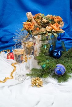 Glasses with wine on a decorative fabric background
