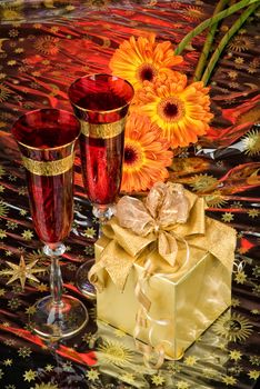 Glasses with wine on a decorative fabric background