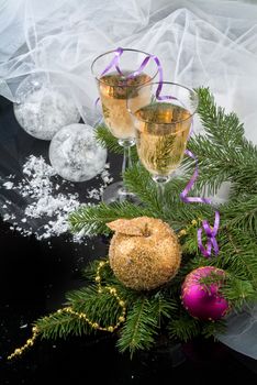 Glasses with wine on a decorative fabric background